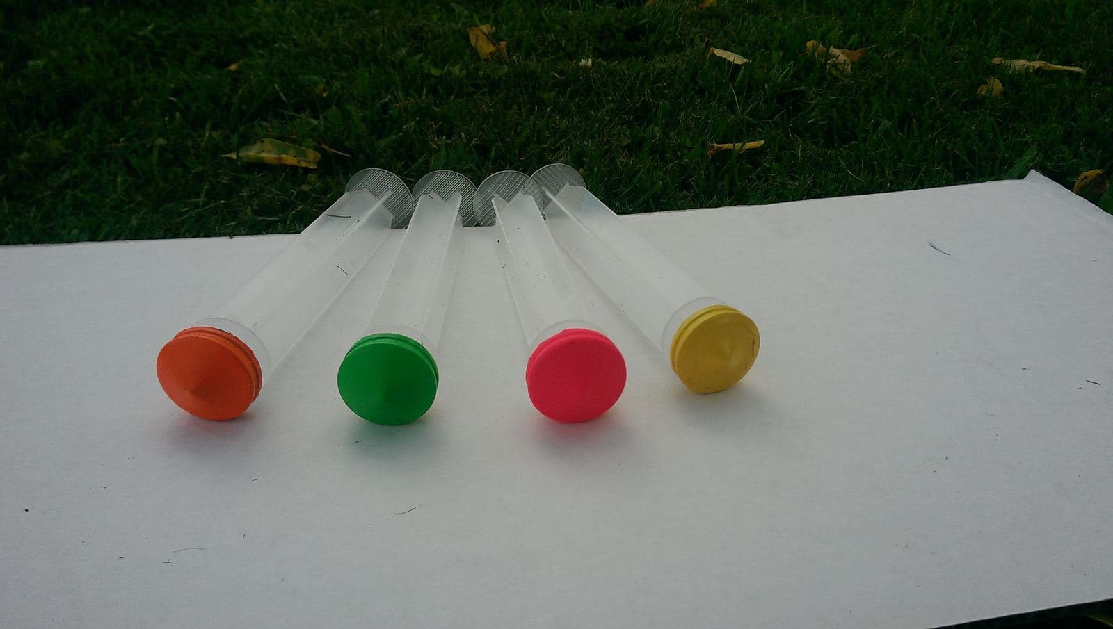 Close view of an early prototype syringe barrel and colored plunger seal.